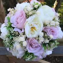 wedding bouquet of artificial pale pink roses and peony