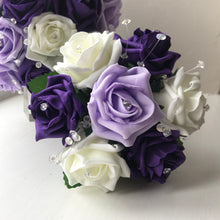 A bouquet collection of artificial purple lilac & ivory foam roses with diamante