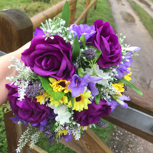 a wedding bouquet collection of purple and yellow daisies & freesia