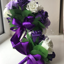 A bouquet collection of artificial purple lilac & ivory foam roses with diamante