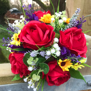 A bouquet collection featuring red, yellow and purple artificial silk flowers