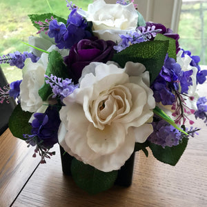 purple and ivory flower arrangement