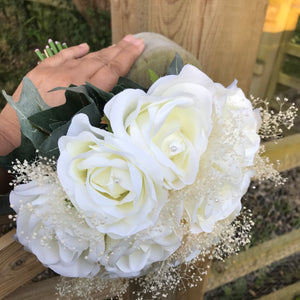 A wedding bouquet using dried and silk flowers