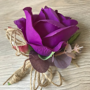 A collection of wedding bouquets featuring  artificial purple flowers & thistles