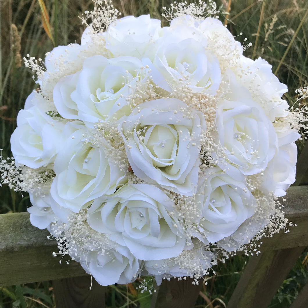 bleached gyp and silk roses feature in this wedding bouquet