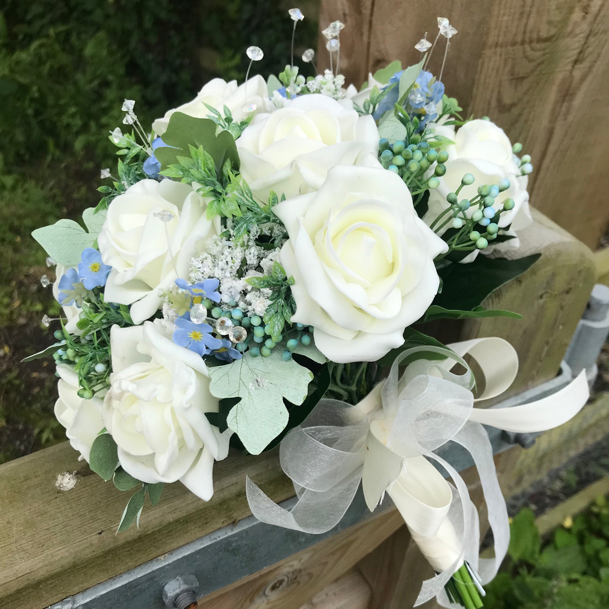 A wedding bouquet collection of forget me not s ivory or white