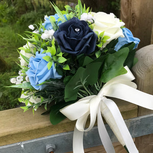 a wedding bouquet collection of roses and lily of the valley