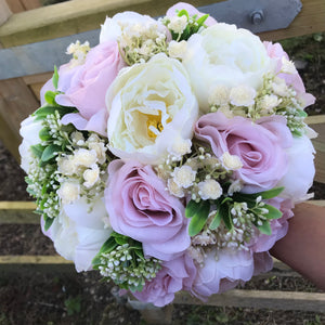 wedding bouquet of artificial pale pink roses and peony