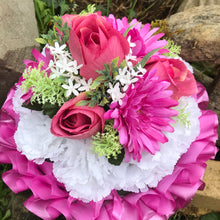 a based funral posy in shades of pink and white