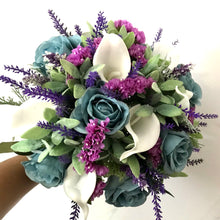 A brides bouquet of white calla, teal roses and foliage