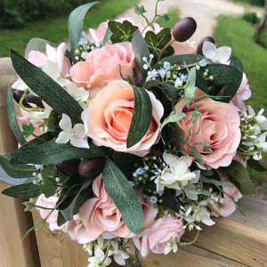 A medium bridal bouquet featuring blush & pink flowers