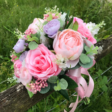A wedding bouquet of lilac & pink artificial silk flowers