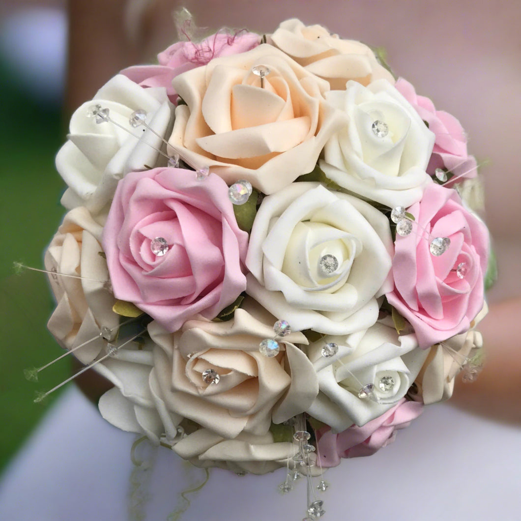 a wedding of pink ivory and champagne foam roses