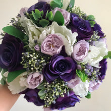 articial wedding bouquet of puple flowers