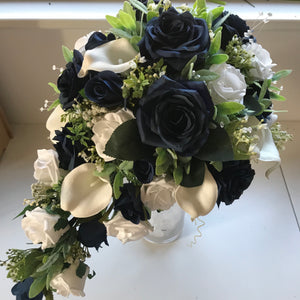 A teardrop bouquet collection of artificial roses, gyp and calla lily