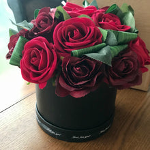 A Large flower design featuring Faux Silk Red Roses in Hat Box