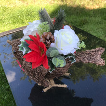 christmas grave side memorial robin with flower arrangement