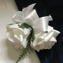 A rose buttonhole with diamanté centres (choice of 36 colours)