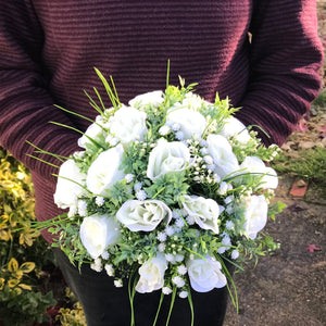 A collection of wedding bouquet featuring ivory roses and gyp