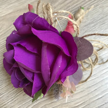 A collection of wedding bouquets featuring  artificial purple flowers & thistles