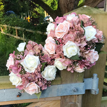A wedding bouquet collection featuring ivory & pink rose flowers