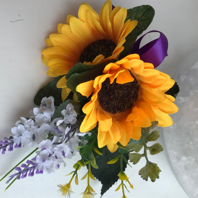 A corsage of sunflowers and lavender