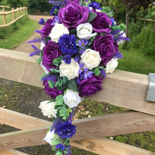 A teardrop bouquet collection of ivory and purple flowers