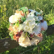 Brides bouquet of hudrangea, calla, rose flowers and foliage