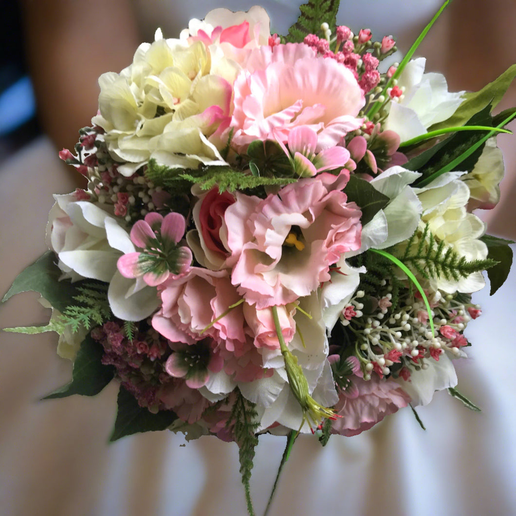 A bridal bouquet of Lisianthus roses and hydrangea