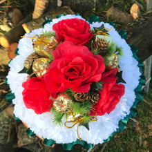 A christmas graveside memorial red and white flower posy