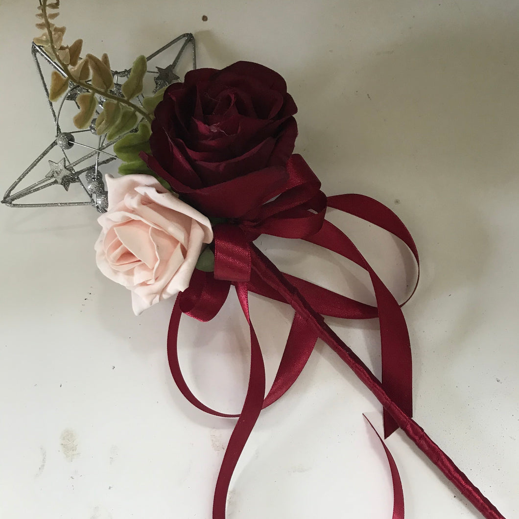 an artificial flowergirls wand