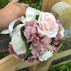 A wedding bouquet collection featuring ivory & pink rose flowers