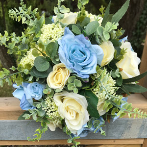 A bridal bouquet in shades of blue and lemon