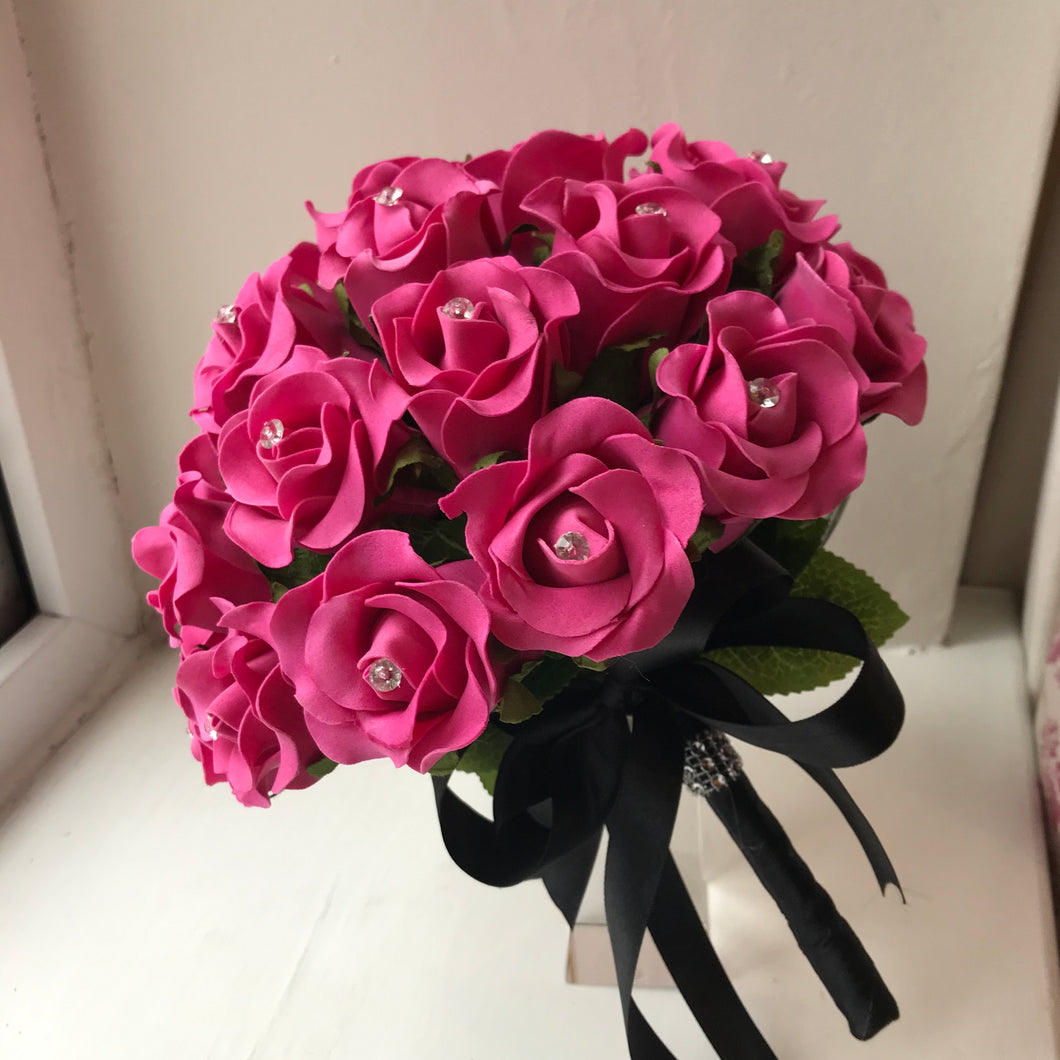 A bridal bouquet of cerise foam rose flowers
