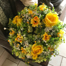 A flower wreath featuring artificial flowers