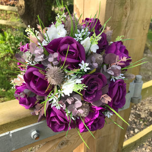 A collection of wedding bouquets featuring  artificial purple rose flowers & thistles