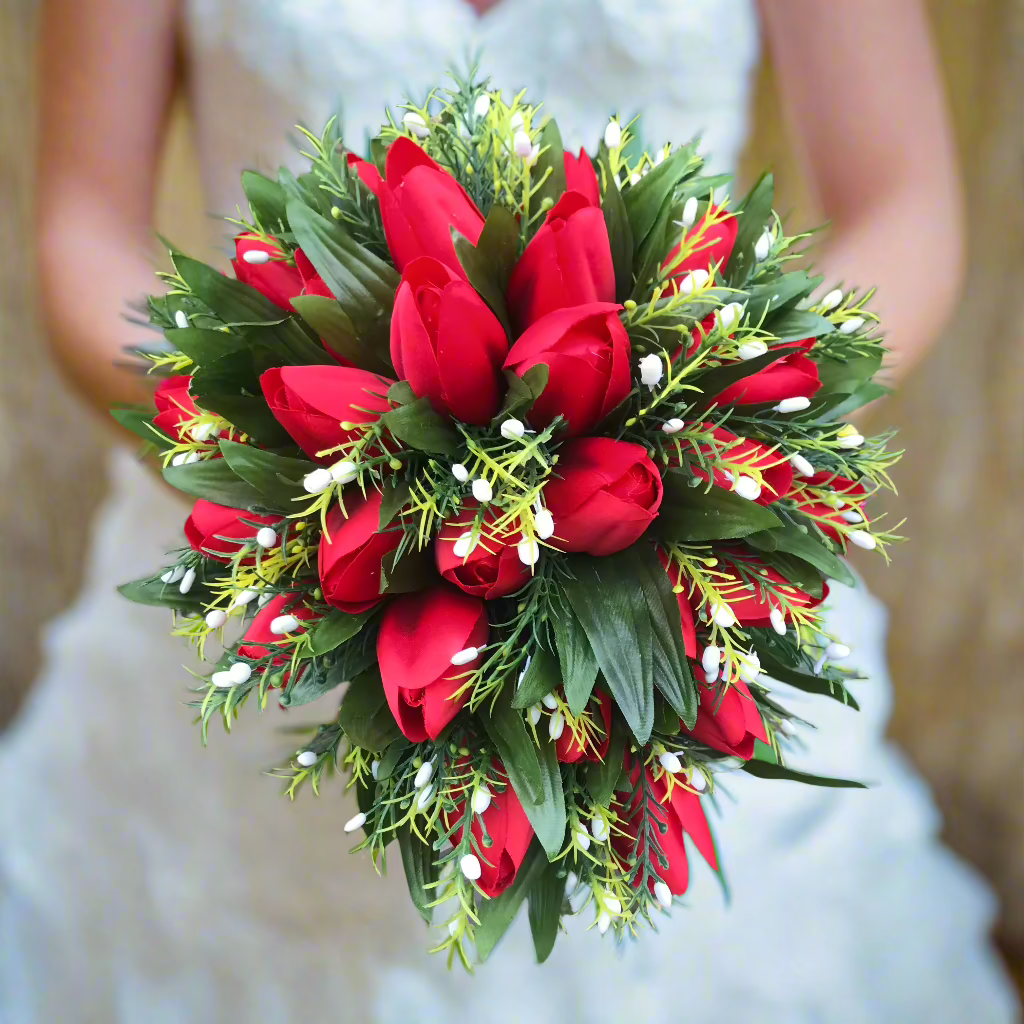 an artificial shower, cascade, teardrop type bouquet featuring red silk tulips