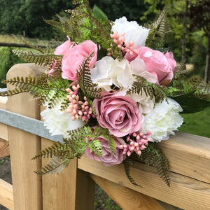 A bridal bouquet collection of artificial silk pink roses, peony & berries