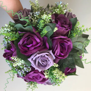 a wedding bouquet of purple and lilac foam and silk roses