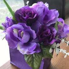 A bouquet arrangement in purple box