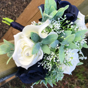 A teardrop bouquet collection of artificial roses, gyp and calla lily