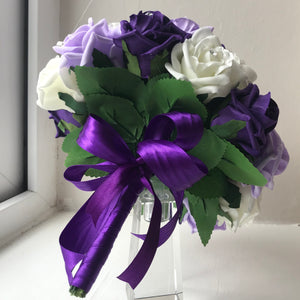 A bouquet collection of artificial purple lilac & ivory foam roses with diamante
