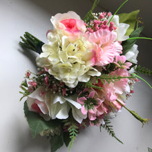 A bridal bouquet of Lisianthus roses and hydrangea