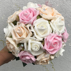 A wedding bouquet of artificial ivory champagne & pink foam Roses