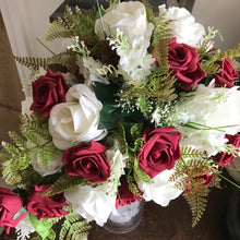 A teardrop bouquet collection of artificial ivory and red roses