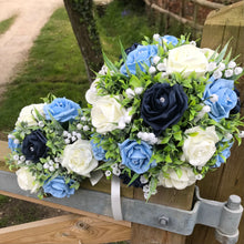 a wedding bouquet collection of roses and lily of the valley