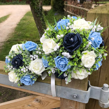 a wedding bouquet collection of roses and lily of the valley