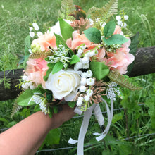 A wedding bouquet of artificial silk ivory & peach roses & hydrangeas