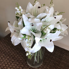 artificial white lilies in vase