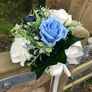 a wedding bouquet collection of roses and lily of the valley